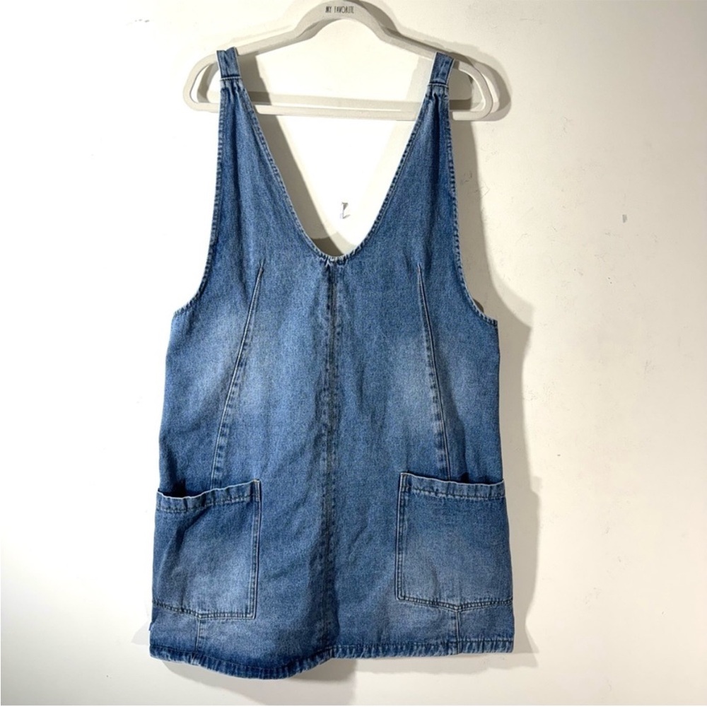 Bib overall denim jumper dress with adjustable straps and large pockets